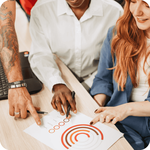 Teammates looking over data